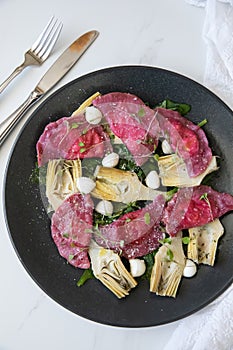 Beetroot Ravioli/Pelmeni filled with Ricotta-Goat cheese, sauteed Artichokes hearts in a sage butter sauce