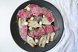 Beetroot Ravioli/Pelmeni filled with Ricotta-Goat cheese, sauteed Artichokes hearts in a sage butter sauce