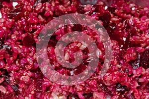 Beetroot risotto extreme close up - Healthy food full frame background. Top view organic beetroot rice macro photography.