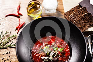 Beetroot soup Borscht with meat and sourcream in a bowl. Delicious healthy Russian traditional food closeup served for