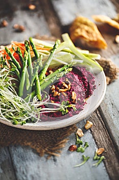 Beetroots Hummus Salad with Green Asparagus, Carrots. Healthy and Vegetarian Salad