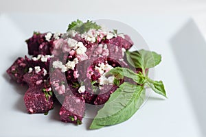 Beets salad with feta cheese, parsley and basil