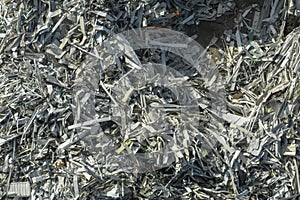 Beg pile of scrap aluminum metal siding from ruined houses after hurricane Ian swept through Florida. Recycle of broken