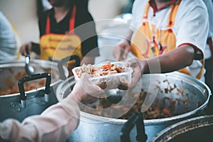 Beggar begs food from donors: The Concept of Hunger Hunger: : The concept of feeding