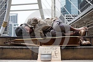 beggar or Homeless man sleep and get cold at winter