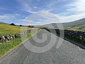 Beggarmans Road, with stone walls, and distant hills near, Hawes, Yorkshire, UK