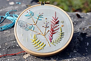 beginners embroidery hoop with simple stitches on canvas