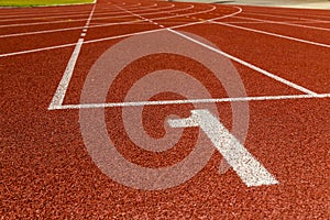 The beginning of the athletics track.