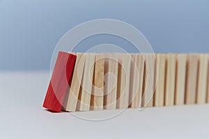 Beginning of end. Financial crisis. Total collapse mockup, copy space. Domino effect. Falling domino blocks, red plank