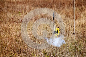 The beginning of the flight of a rocket model in the field