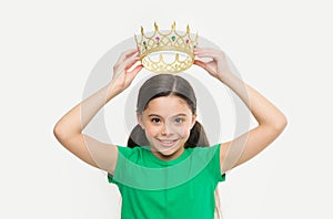 Behaving like princess is work. Kid wear golden crown symbol of princess. Girl cute child wear crown. Childhood concept photo