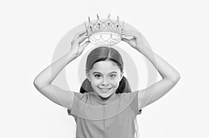 Behaving like princess is work. Kid wear golden crown symbol of princess. Girl cute child wear crown. Childhood concept photo