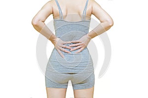 Behind body of a woman in gray clothes put her hands on the back area at spot of ache or waist pain, Health-care concept on white