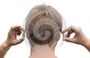 Behind-the-ear hearing aid putting on