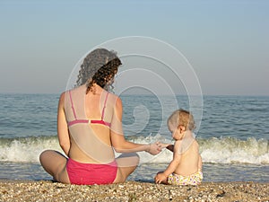 Behind mother with baby