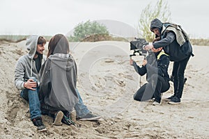 Behind the scene. Actor and actress in front of camera