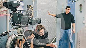 Behind the scene. Film crew filming movie scene in studio