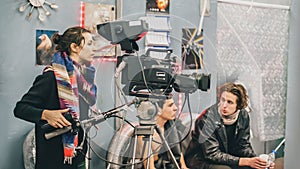 Behind the scene. Film crew filming movie scene in studio