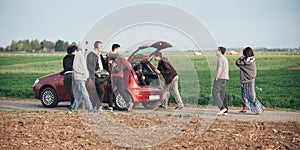Behind scene improvisation. Film crew team pushing car with came photo