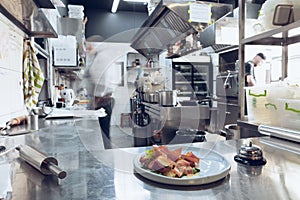 Behind the scenes of brands. The chef cooking in a professional kitchen of a restaurant meal for client or delivery