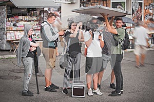 Behind scenes. Film crew team shooting movie scene. Group filmmaking