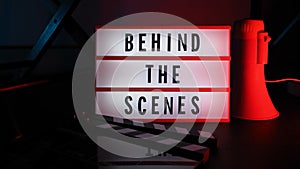 Behind the scenes light box. Text on cinema light box