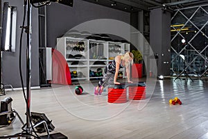 Behind the scenes of video production or video shooting of woman in sportswear doing crossfit