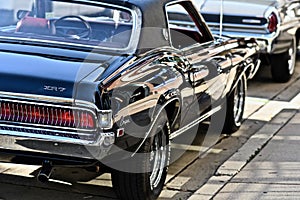 Behind shot of an old-fashioned black classic Rambler car in Downers Grove, United States