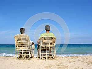 Behind sitting couple on beach 2