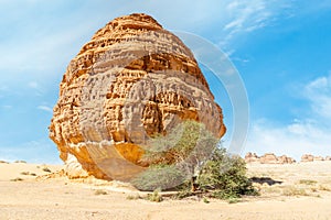 Behind the Tomb of Lihyan, son of Kuza carved in rock in the desert, Mada\'in Salih, Hegra, Saudi Arabia photo