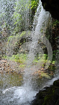 Behind the waterfall Sgwd yr Eira in Brecon Beacons