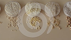 Beige background with gluten-free flour from different grains and seeds