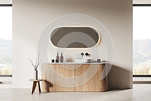 Beige bathroom interior with tub