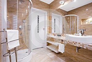 Beige bathroom with shower