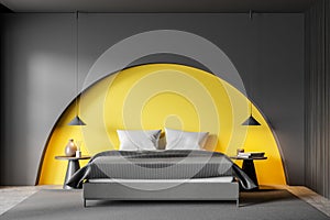 Beige bedroom with bright yellow wall arch