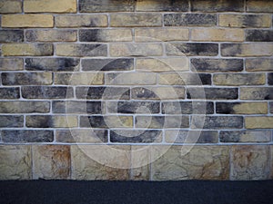 Beige and black brick wall abstract background texture
