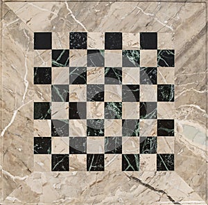 Beige and black marble mosaic chess board, empty textured backdrop