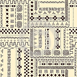 Beige and brown traditional ethnic african mudcloth fabric seamless pattern, vector