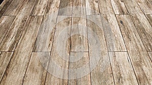 Beige brown wooden planks, strips wall cladding interior panel of natural wood. Laminate sheet floor tiles, random