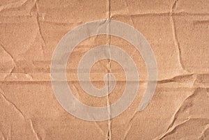 Beige cardboard texture. Crumpled cardboard. Copy space.