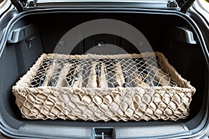 Beige Cargo Net Organizer in Car Trunk