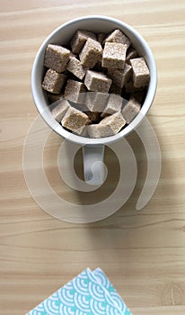 Beige ceramic bowl full of brown sugar