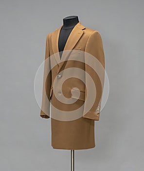 Beige coat on a mannequin in the studio