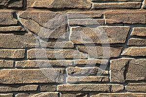Beige-colored decorative stone wall, texture, background