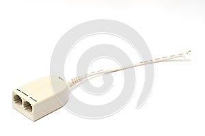 A beige colored micro-filter short cable adapter