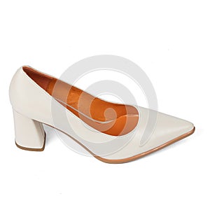 Beige comfortable office women's shoes with black sole with thick heels and a sharp nose on a white background