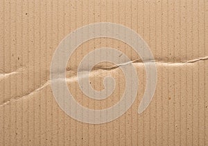 Beige corrugated cardboard with a subtle vertical stripe pattern. A
