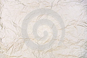 Beige crumpled paper texture background. Old grunge white paper backdrop. Wrinkled paper. Copy space for text, design art work.