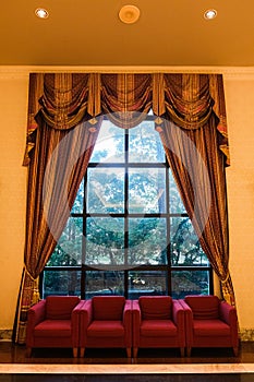 Beige curtains in a classic style.Interior
