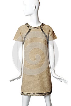 Beige dress on a mannequin